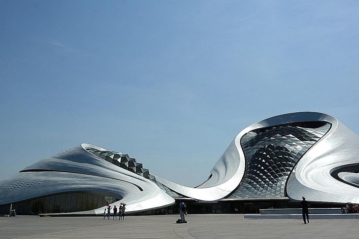 The striking Harbin Opera House (above) sits amid the wetlands along the Songhua River.