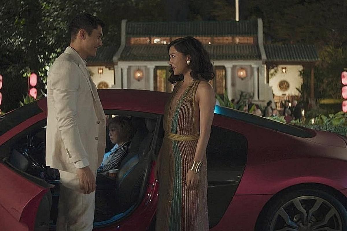 In Crazy Rich Asians, economics professor Rachel Chu (Constance Wu, right) discovers that her boyfriend, Nick Young (Henry Golding), belongs to one of Singapore's wealthiest families during a visit to the country.