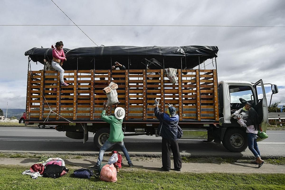 Migrants sleeping along the Pan-American Highway in Ecuador, which has become home to about 40,000 Venezuelans. Hours before Peru imposed new entry restrictions last month, Ecuador opened a "humanitarian corridor" to allow the migrants to head toward
