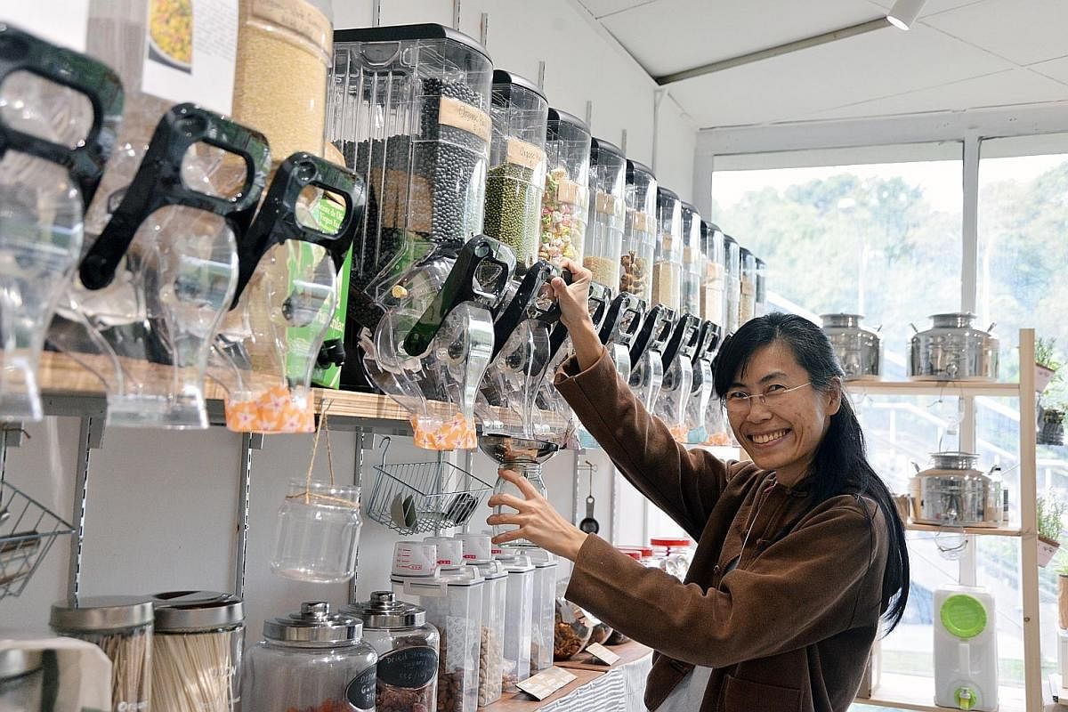 Ms Thng Hui Hien, 44, quit her job as an oil and gas laboratory manager to set up Eco.Le, where dried goods are not pre-packaged but stored in glass containers. Co-founder Agatha Lee (above) of The Green Collective, which offers sustainable products;