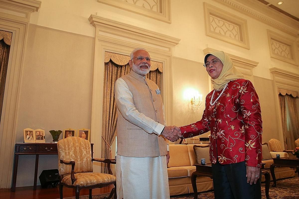 President Halimah with Mr Paul Simon before tucking into a meal prepared by him at the Istana on Jan 24. She reached out to him after reading a report in The Straits Times about his wish to cook for her. Mr Simon, who works at a hotel and has mild in