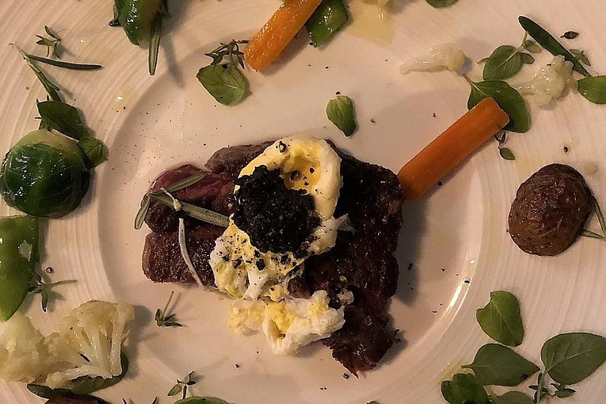 The ribeye (left) makes for pleasant eating with a garland of vegetables, while the beef carpaccio (above) has a melange of flavours from the parmesan cheese, dollops of burrata cheese, basil leaves and olive oil.