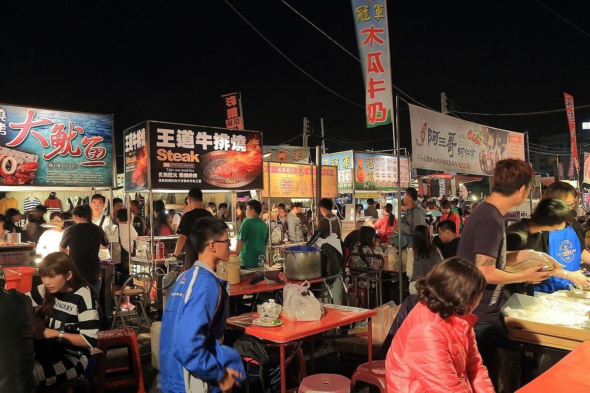 The Tainan flower night market (above), which also offers street food. However, the city also offers interesting yet traditional fare, such as milkfish congee and danzai noodles.