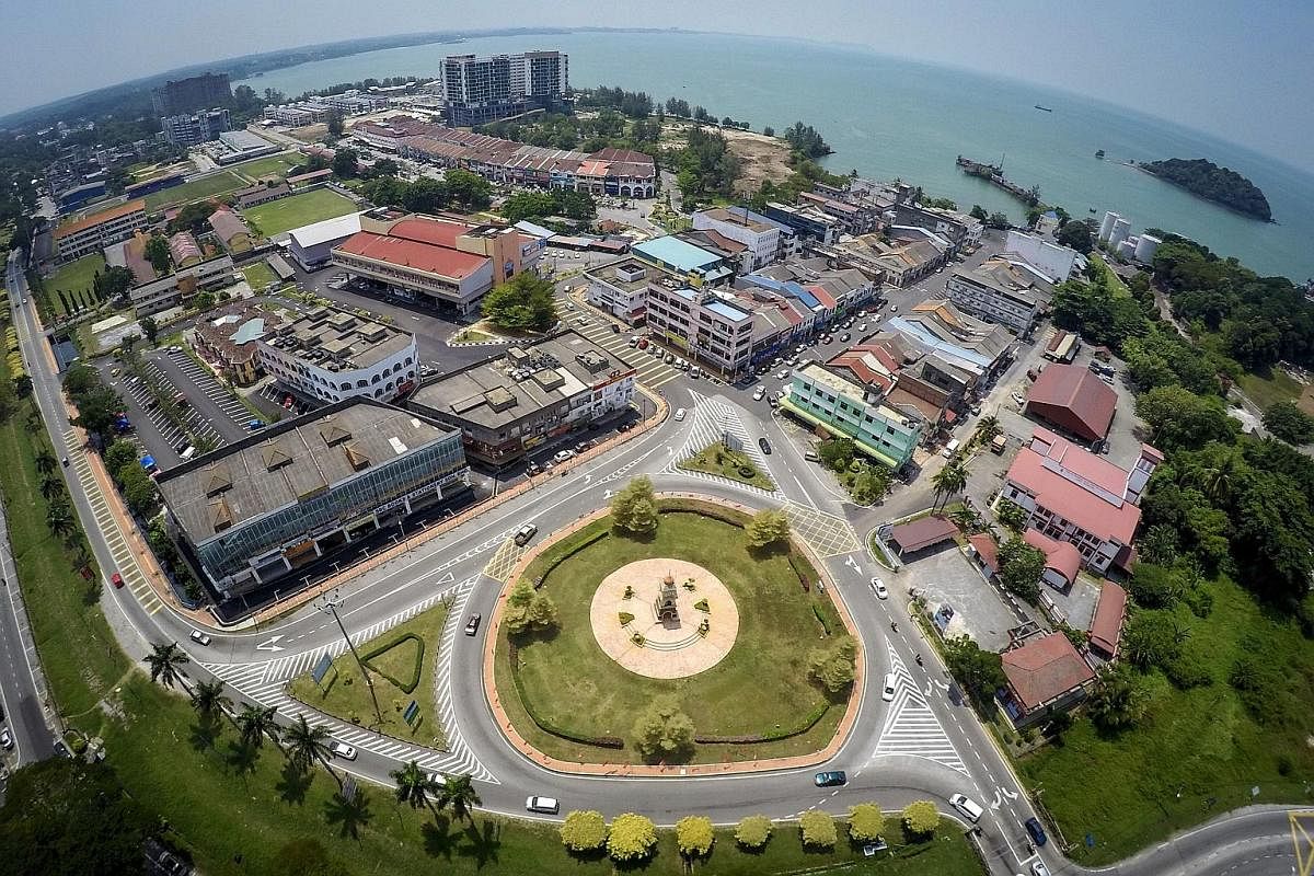 Left: An aerial view of Port Dickson, with hotels lining the more than 20km of beachfront (top left). It was a weekend draw for the middle class in its heyday. Mr Mohd Nazari Mokhtar, 57, is the Parti Islam SeMalaysia candidate for the Port Dickson b