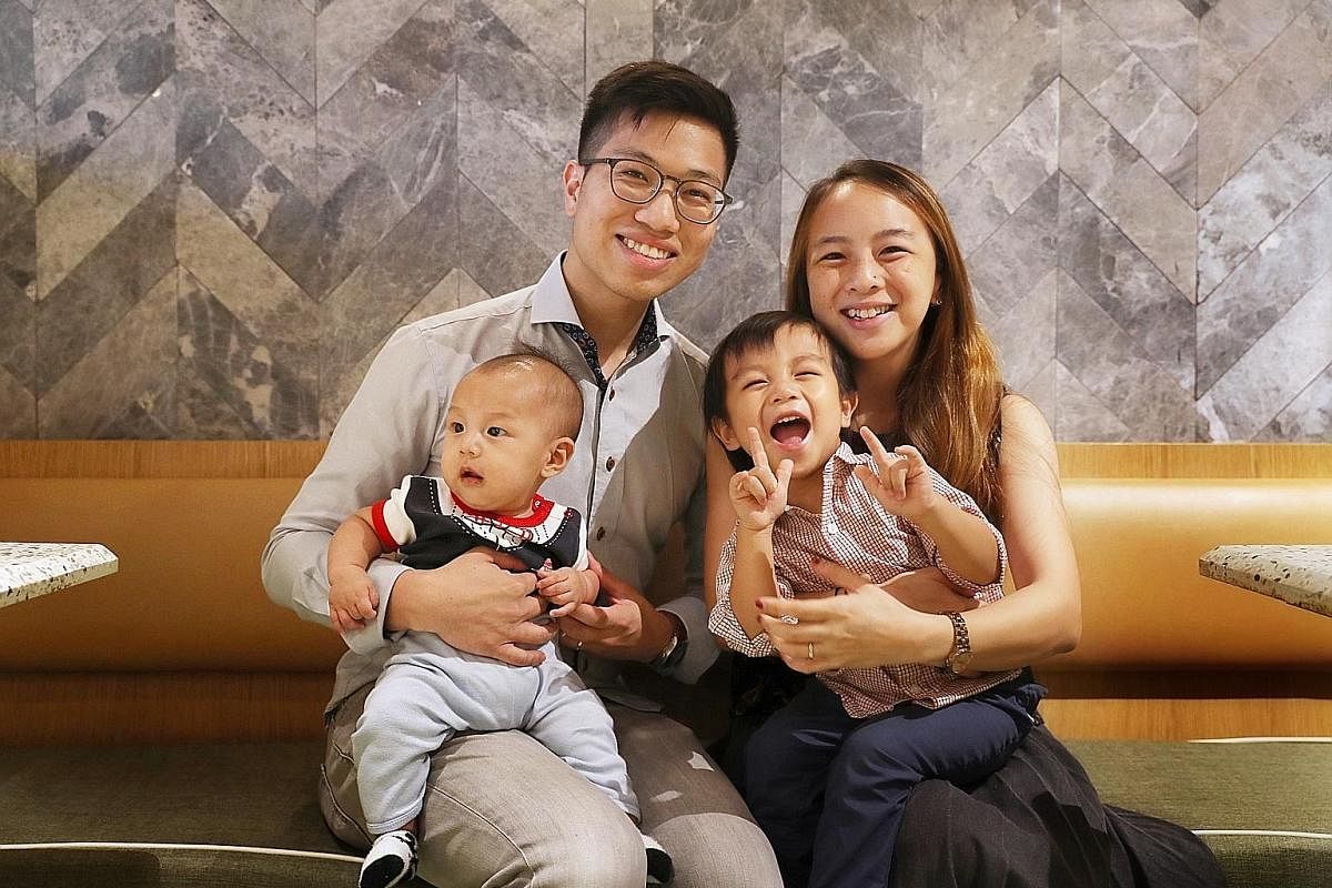 Above: Mr Joachim Lim and Ms Janis Wong with their sons Jude, four months old, and Jotham, 21/2, who is signing "I love you". Left: Ms Applie Wan signing "eat" to her daughter Amelie, 13 months old.
