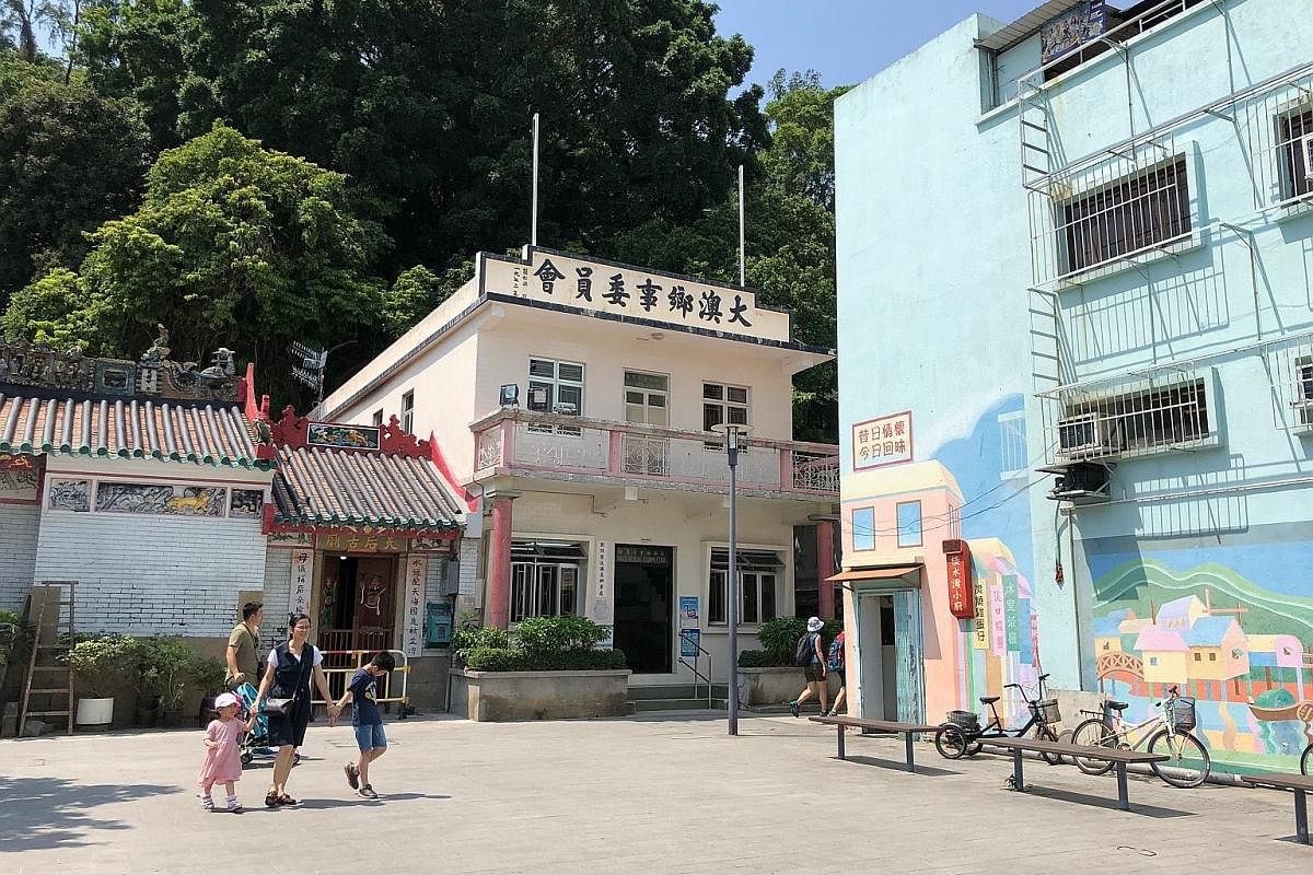 Left: Tai O's temple, rural committee office and school are located in the same area, a reflection of the community's close-knit ties. Below: The name Tai O refers to water channels and the once-bustling village that was one of Hong Kong's most vital