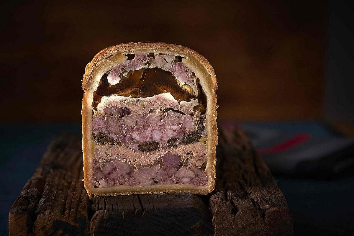 A foie gras terrine. Fromage de tete (head cheese, left) in a salad, andouillette de Troyes (chitterlings sausage, top) and foie gras (fatty liver, above).