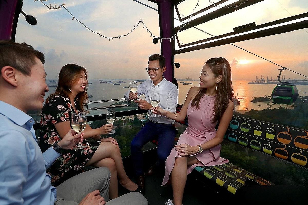 This posed photo shows how participants of an upcoming Love In The Air speed-dating event will get to meet other singles in cable cars decked out with fairy lights under the evening sky. Above: A workshop organised by Dating Moments for singles who a