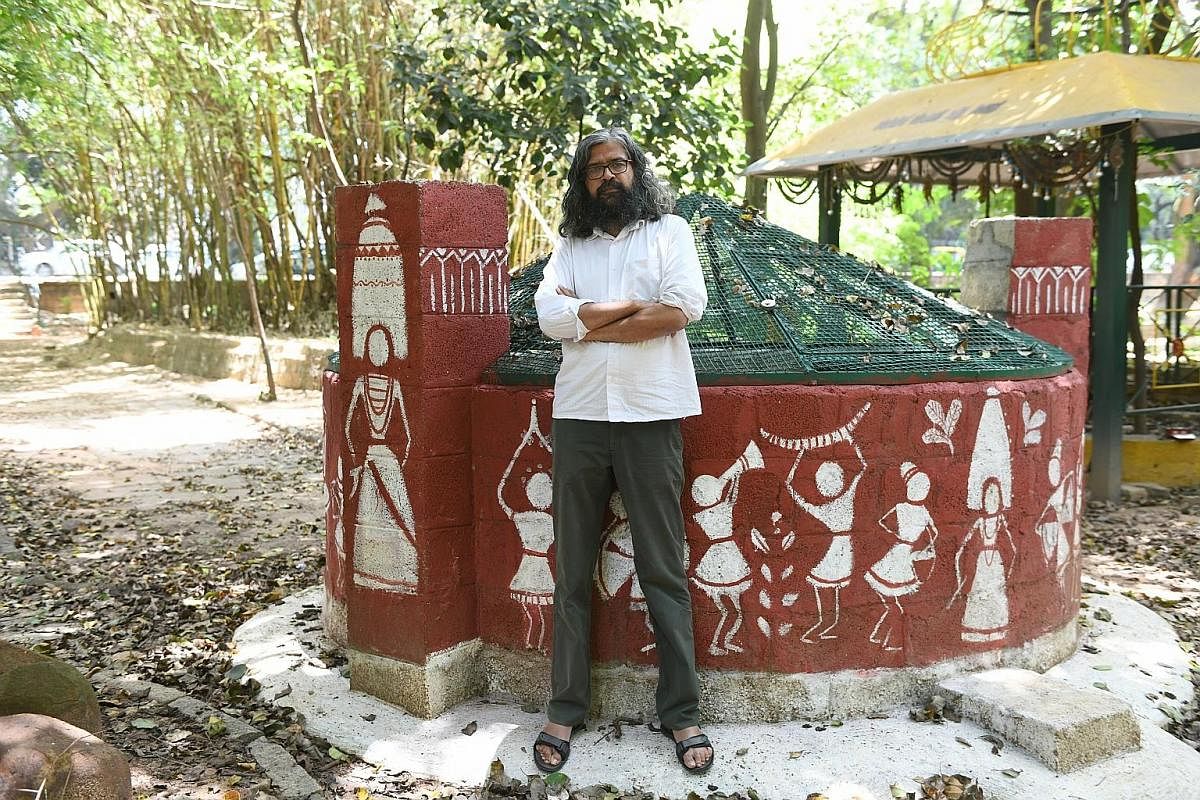 Farmer C.P. Krishna tackles the water shortage by cultivating crops that require less water and avoiding the use of chemical fertilisers because they require more water. Water activist Vishwanath Srikantaiah stands by a restored well supplying water 
