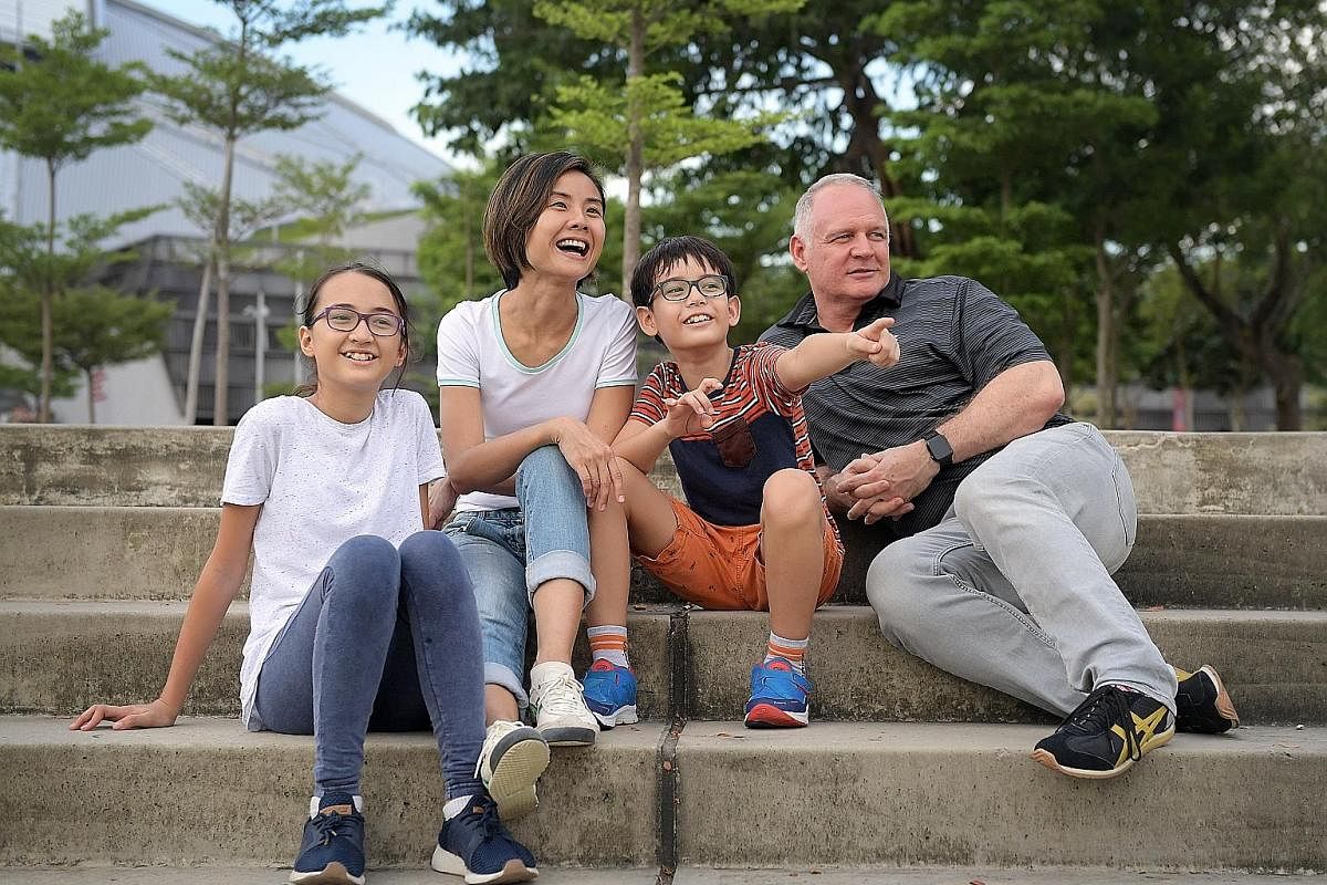 Ms Charlene Tiuson Uy (left), senior associate of advisory services, and legal counsel Fiana Sinha (above), are happy to be back at work after staying home to care for their children. Ms Sharon Teo with husband James Shanahan, daughter Emma and son T