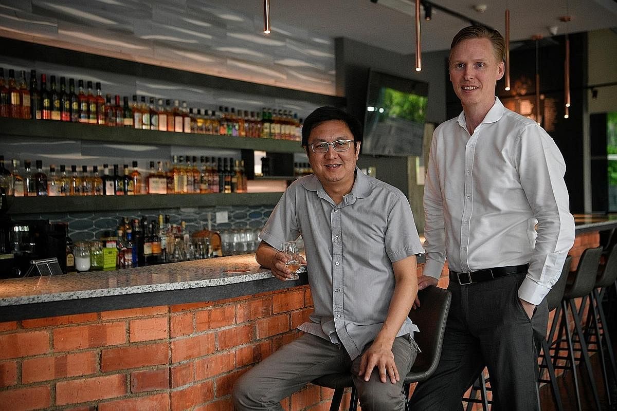 Whisky by the carafe starts at $50. Mr Chua Khoon Hui with Mr Matthew Fergusson-Stewart (both left) from The Whisky Store, which runs The Copper Plate.