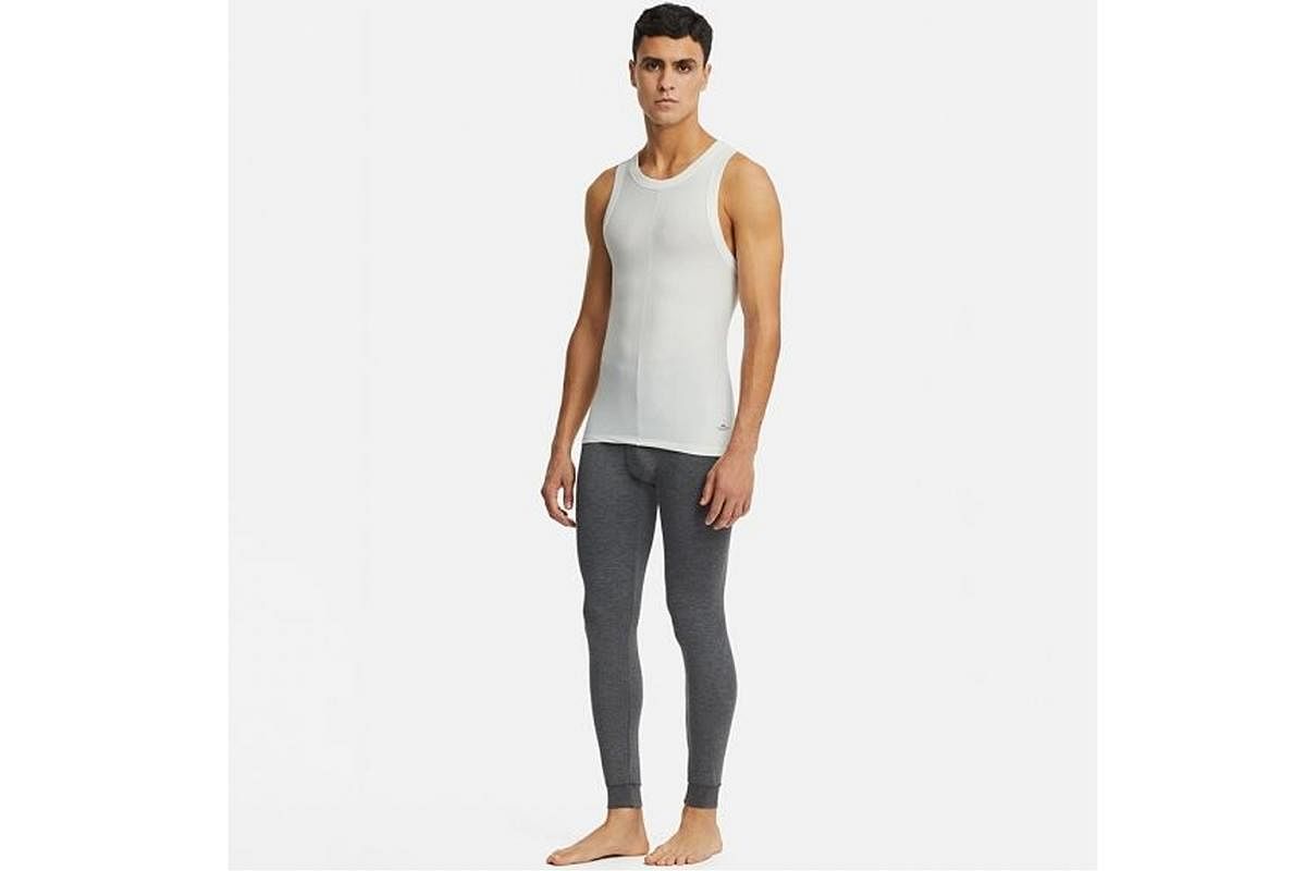 The Uniqlo x Alexander Wang collection of 16 products includes a sleeveless bodysuit ($49.90, left) for women and a tank top ($19.90) and pair of tights ($49.90, both right) for men. (From left) Designer Alexander Wang, Fast Retailing Group chief exe