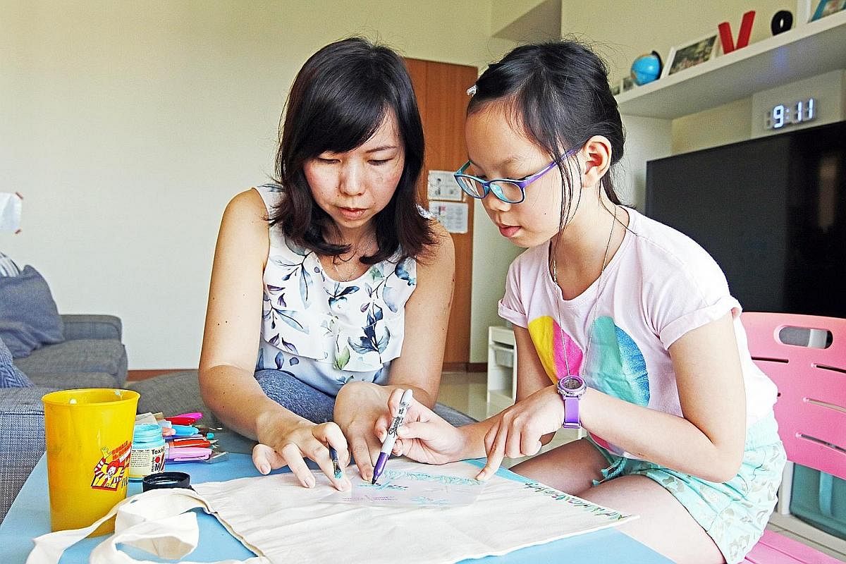 Send the kids for a Flippa Ball camp. Try paper puppet making and wood block printing at the Esplanade. A Lego model of the Sultan Mosque at exhibition Building History: Monuments in Bricks & Blocks. Ms June Yong doing crafts with her daughter, Vera 