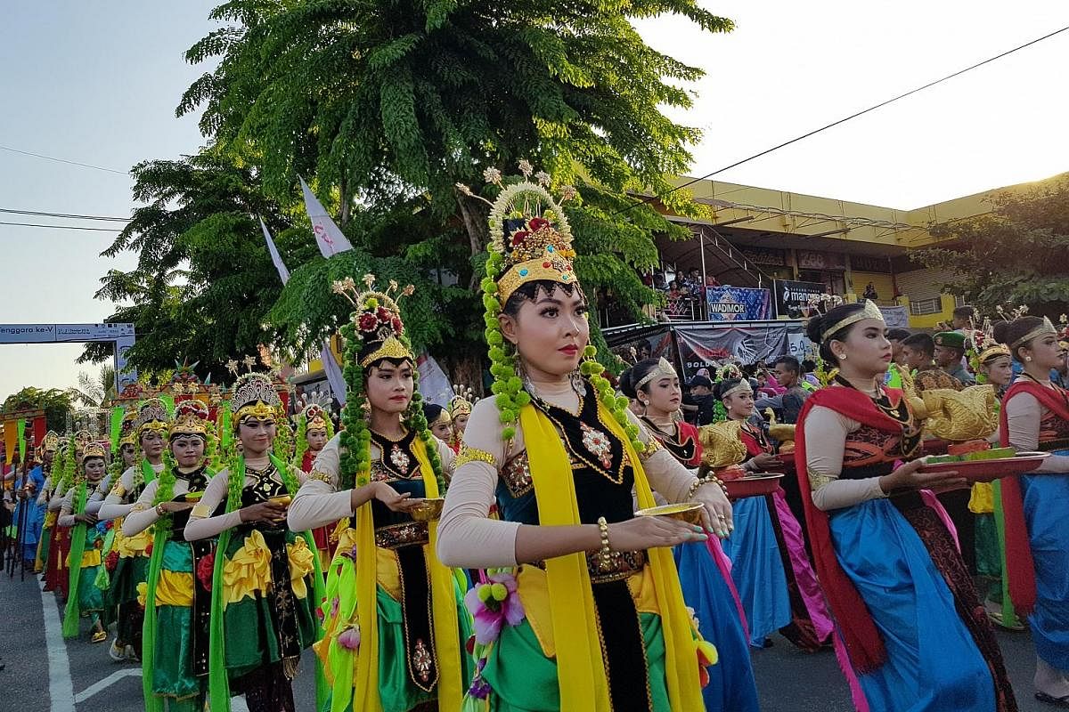Above and left: Representatives from several Indonesian kingdoms marching during the opening ceremony of the annual Asean Palaces and Indigenous Peoples festival on Oct 28 in Sumenep. Chairman of the Indonesian Royal Palace Forum, and Sultan of Cireb