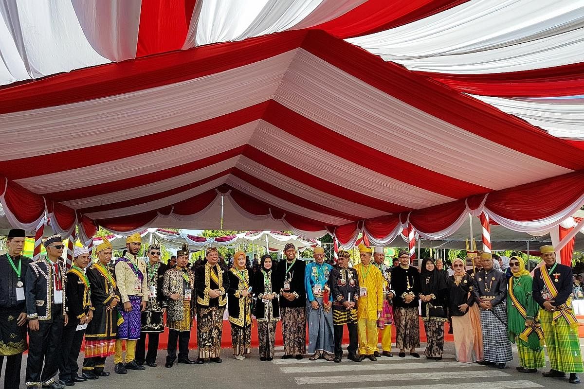 Above and left: Representatives from several Indonesian kingdoms marching during the opening ceremony of the annual Asean Palaces and Indigenous Peoples festival on Oct 28 in Sumenep. Chairman of the Indonesian Royal Palace Forum, and Sultan of Cireb
