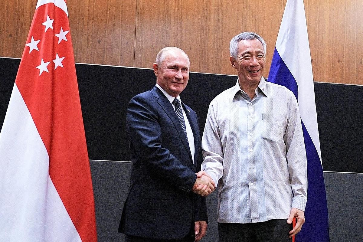On Wednesday, PM Lee met Russian President Vladimir Putin (top left) and reaffirmed their countries' broad-based and longstanding friendship. He also met Indian Prime Minister Narendra Modi (above) that day. They agreed to keep up the momentum toward