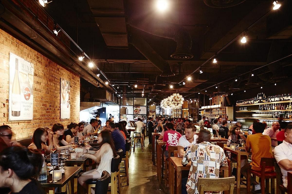 The Wine Connection Tapas Bar & Bistro at Robertson Walk (above) is among its most popular outlets. Ms Caroline Simon (left) is the company's managing director for Singapore and Malaysia.