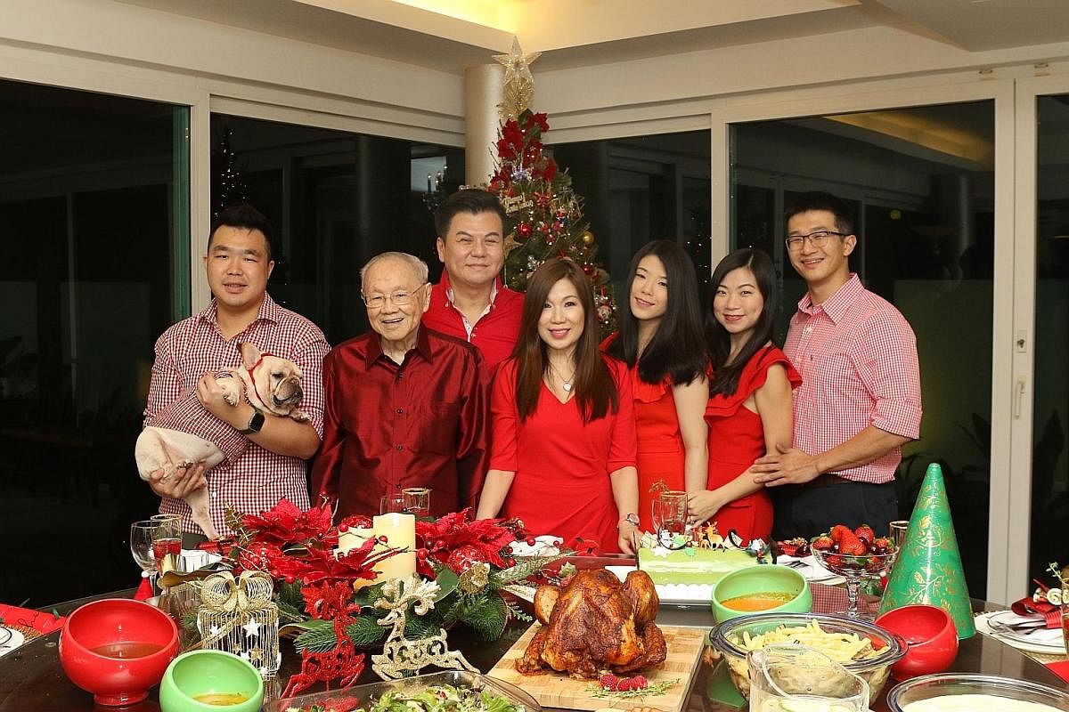 The Pehs' pine tree is always a live one and ordered two months in advance. Stuffed toys from the children's childhood are placed between the leaves. For lawyer Susan Peh (fourth from left), dinner on Christmas Eve is always a cosy one - with her hus