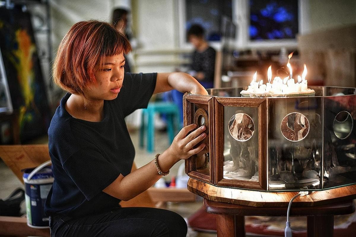 Liza Markus created a sculpture inspired by the tug-of-war she feels regarding her Christian faith and how it was introduced to Indonesia by colonial powers, as well as her curiosity over the Catholic confessional. Nicole Phua's work is inspired by f