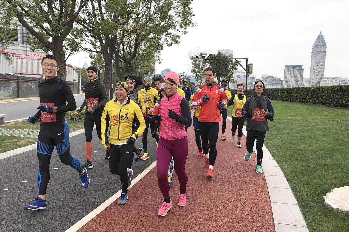Mr Paul Mui (front row, in yellow), originally from Hong Kong, is the founder of the running group Lao Mei - which means "Old Mr Mui" - in Shanghai. Pao tuan, or running groups, in China play a big part in spreading the popularity of the sport. They 