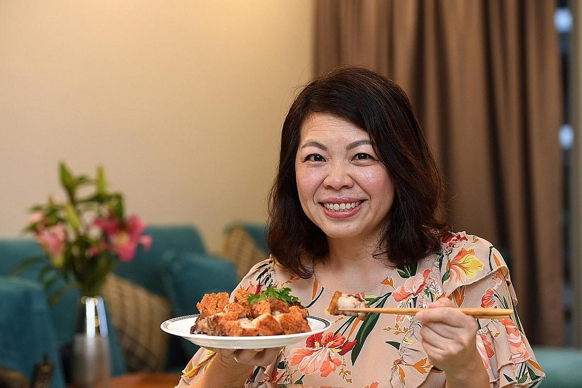 Ms Candice Ong serves her roast pork belly with hand-pounded chilli sauce.