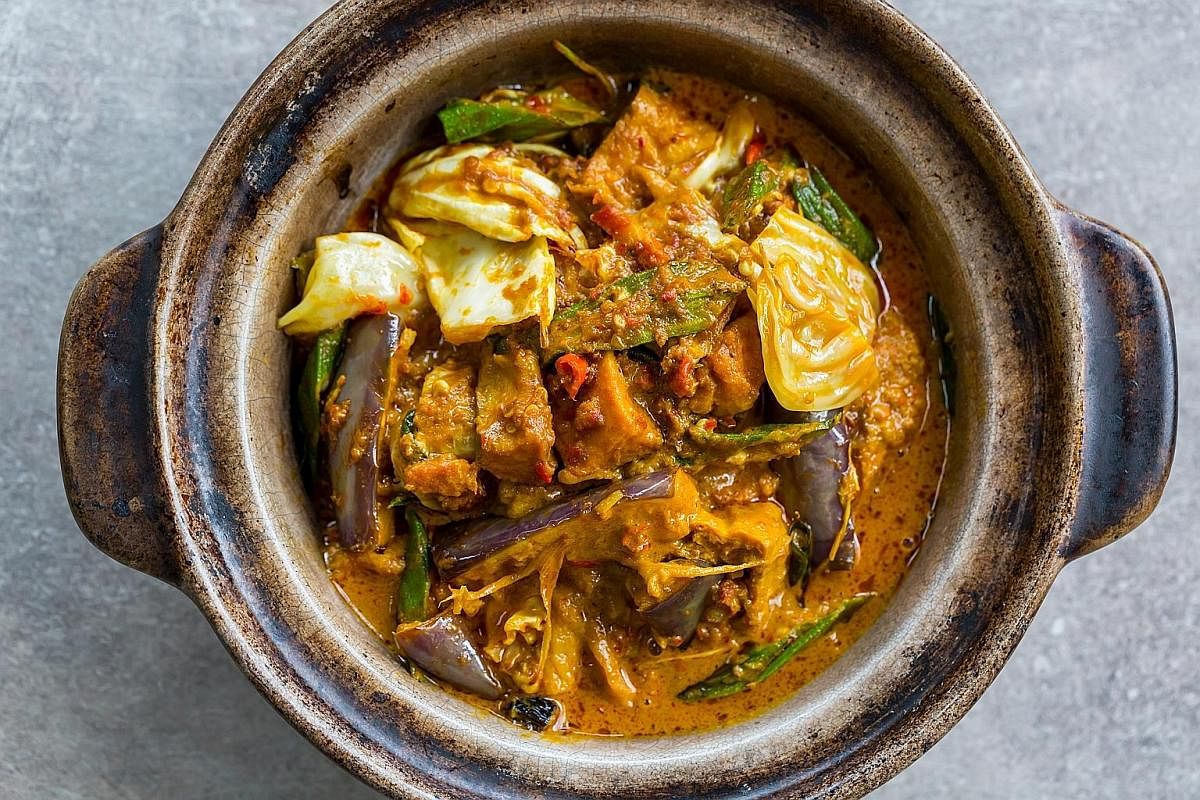 Smoked Pork Curry is an odd dish of house-smoked pork belly cooked in a thick curry with eggplant, lady's finger, cabbage and tau pok.