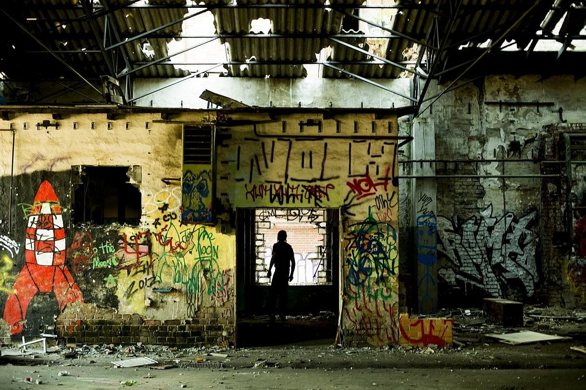 The writer's host Giacomo (in silhouette) took her to look for an abandoned warehouse in Berlin to photograph in 2013.