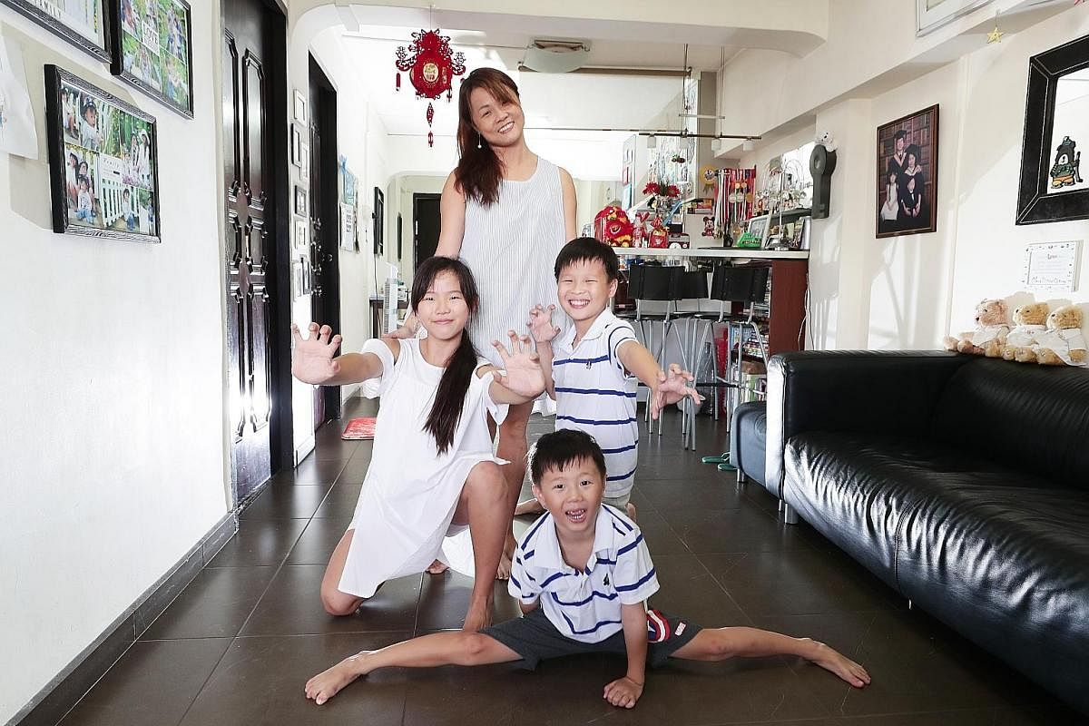 Ms Elizabeth Li with her children Chelsea, 13, Christian, 11, and Chasten, five. She practised breastfeeding on demand and making purees from scratch for them when they were younger and does not regret the labour-intensive practices.