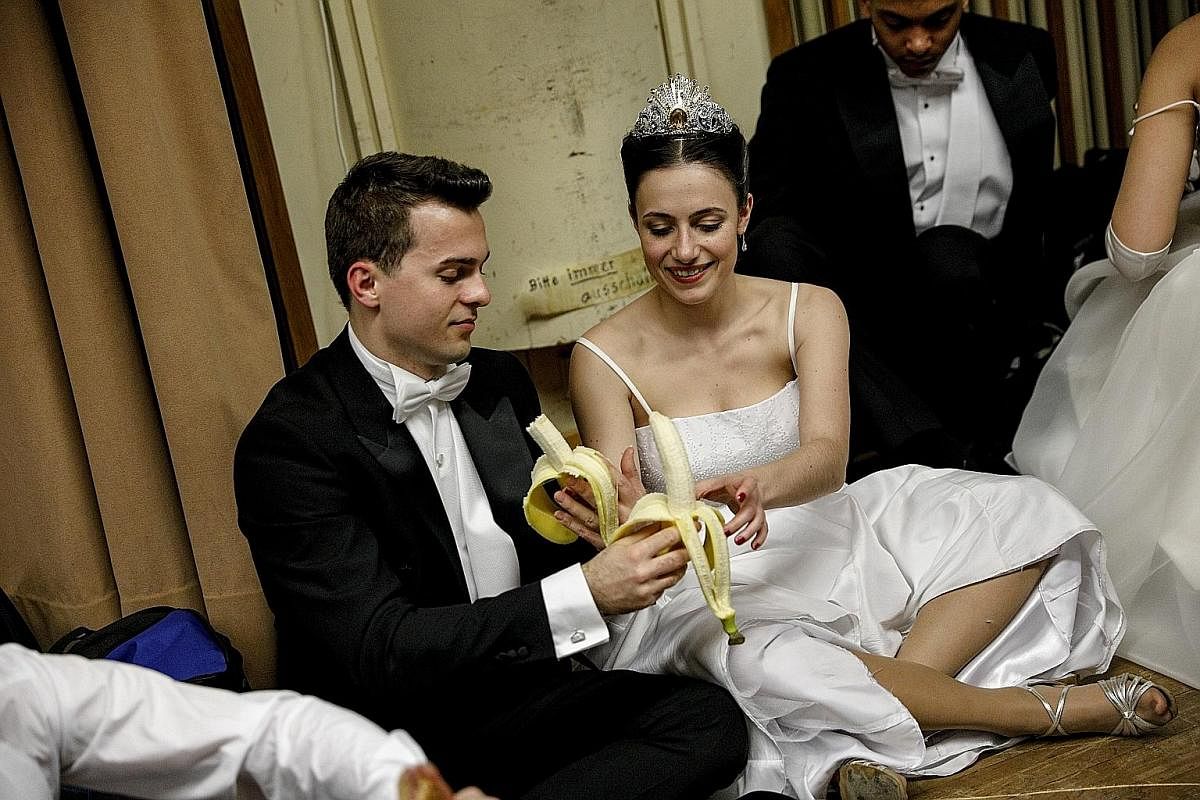 BEHIND THE SCENES: Debutantes fuelling up with bananaS before the opening ceremony of the Vienna Opera Ball last Thursday.