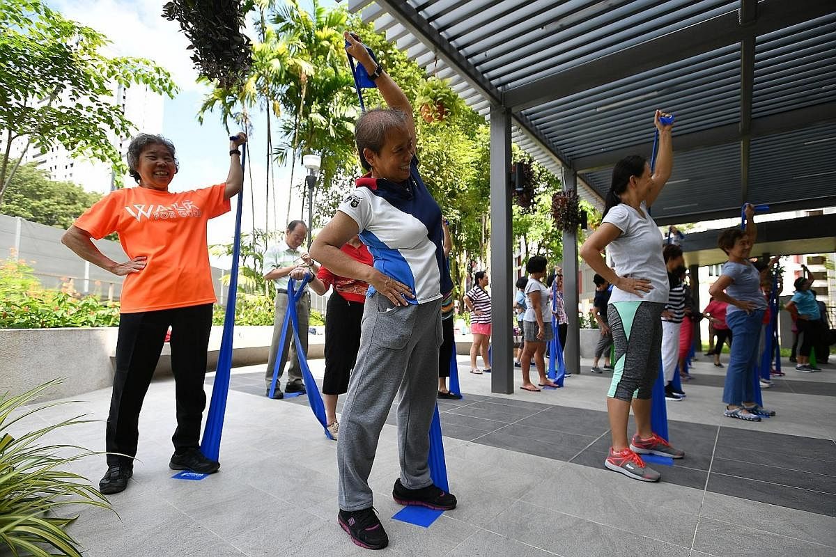 Residents doing resistance band workouts outside the Wellness Centre at the upgraded Teck Ghee Community Club in January. Such workouts can help combat sarcopenia.
