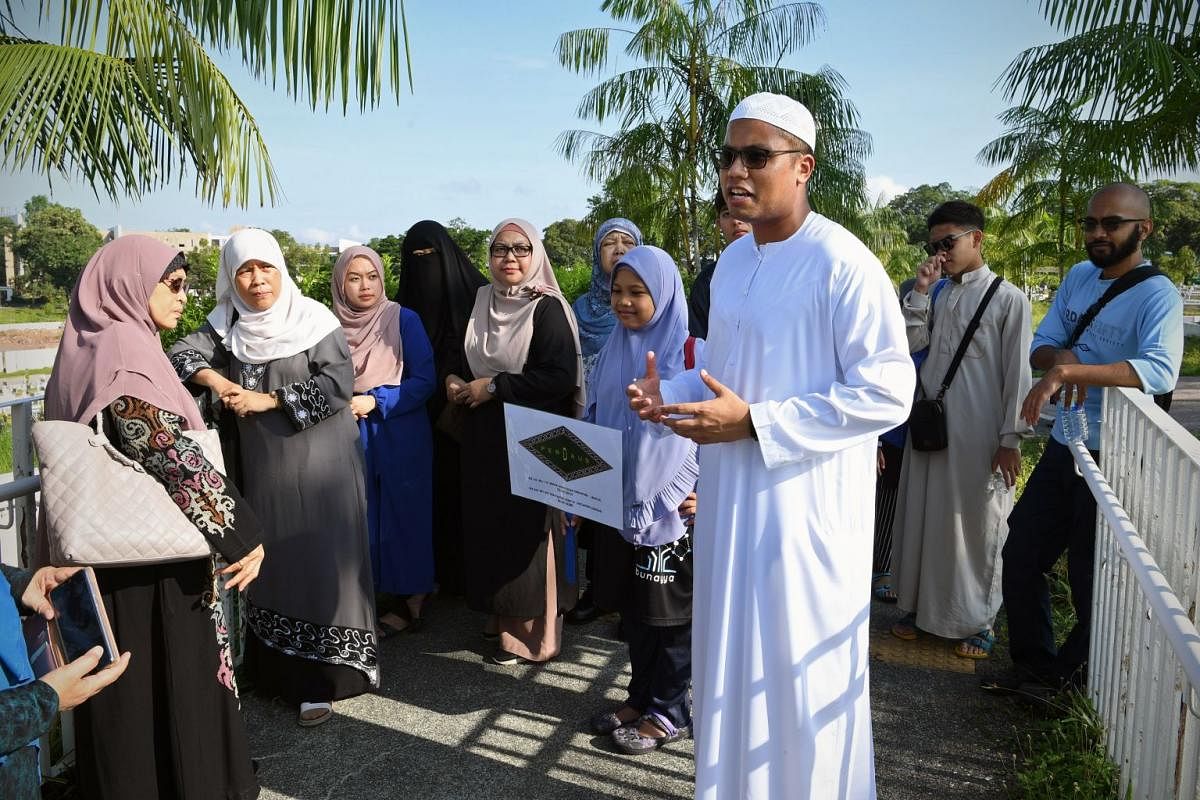 Participants of the Jenazah Management Course with Mr Razaly at the Pusara Aman Cemetery, where they will observe a burial. The deceased’s family has given permission for Mr Razaly to attend the burial for educational purposes.