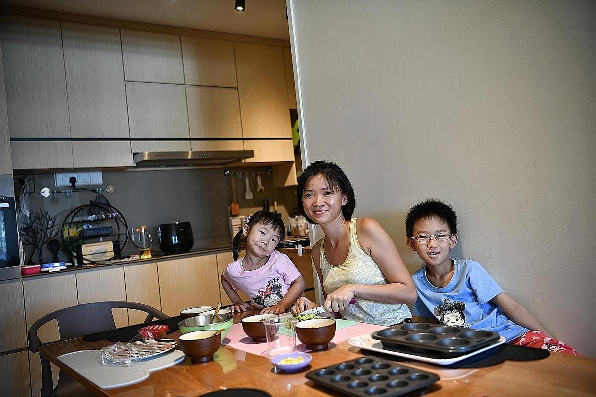 Ms Christine Koh bonding with daughter Yu Tong and son Cheng Jun as they prepare Baked Egg Muffins together.