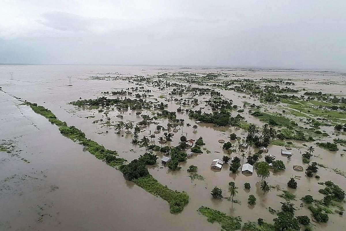 An aerial view of flooded houses after the tropical Cyclone Idai made landfall near the heavily populated Mozambican port city of Beira on Monday, from a photo released by the United Nations World Food Programme. Mozambique's President Filipe Nyusi s