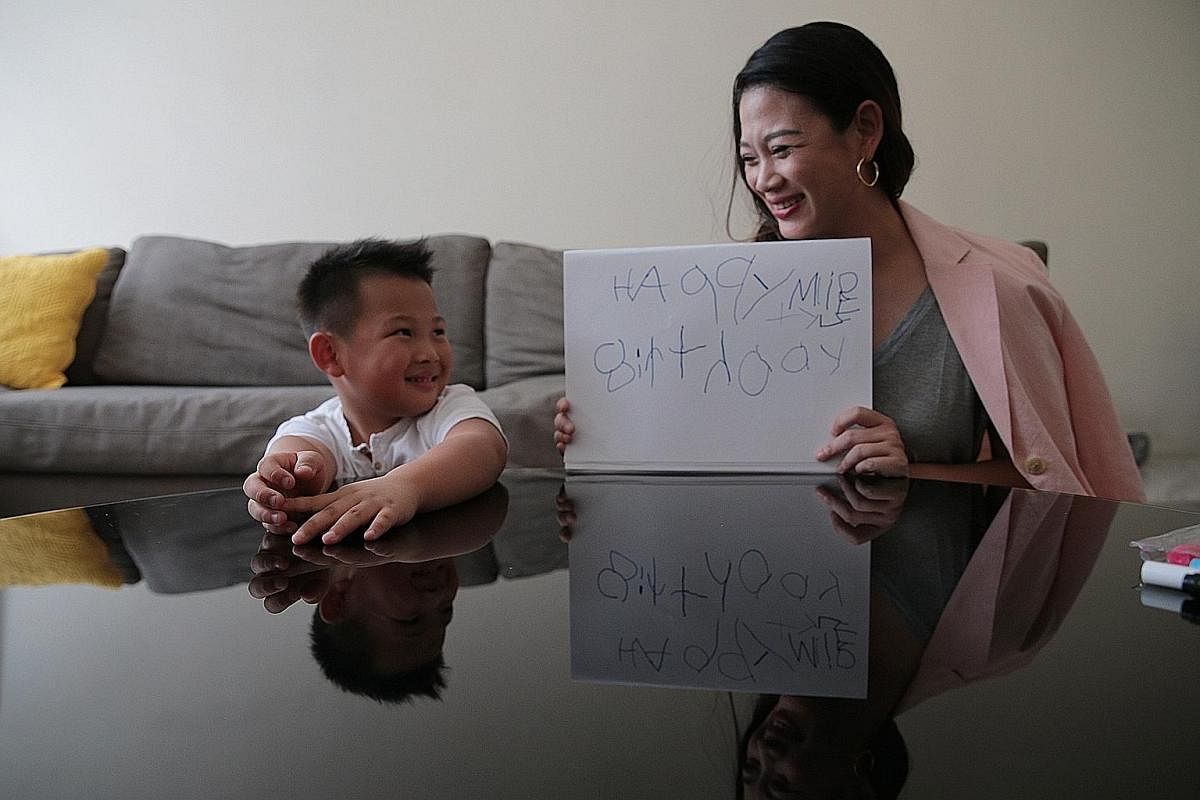 Entrepreneur Tjin Lee and her six-year-old elder son, Tyler, who has dyslexia, who wrote the words "Happy birthday" and his name.