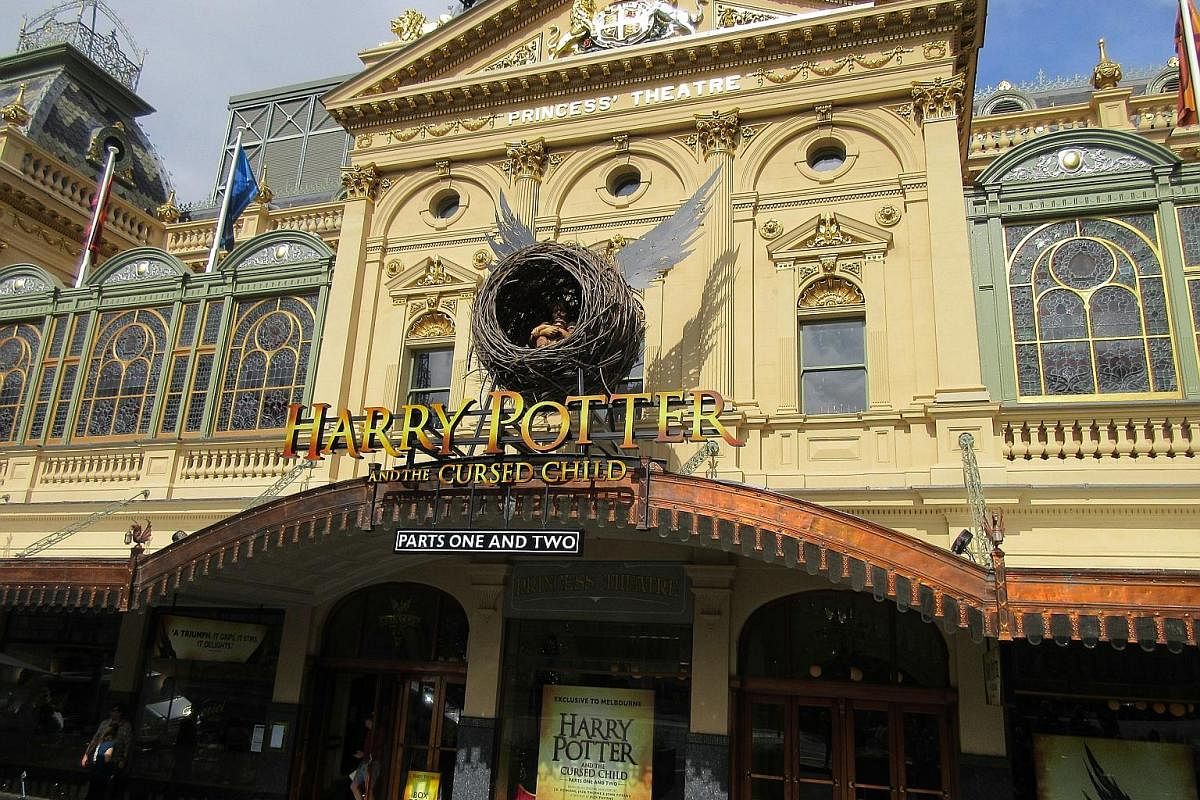 The facade of Melbourne's Princess Theatre features a sculpture of a winged nest holding a small child - the logo of the J.K. Rowling-approved production Harry Potter And The Cursed Child. (From left) Paula Arundell as Hermione Granger, Gyton Grantle