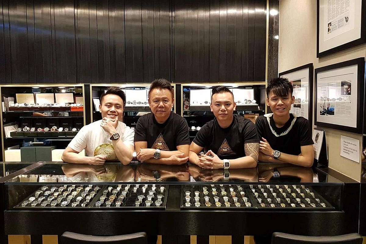 Mr Henry Lim (second from left) and his sons (from left ) Wayne, Nick and Shaun who run Chuan Watch in Golden Landmark Shopping Centre.