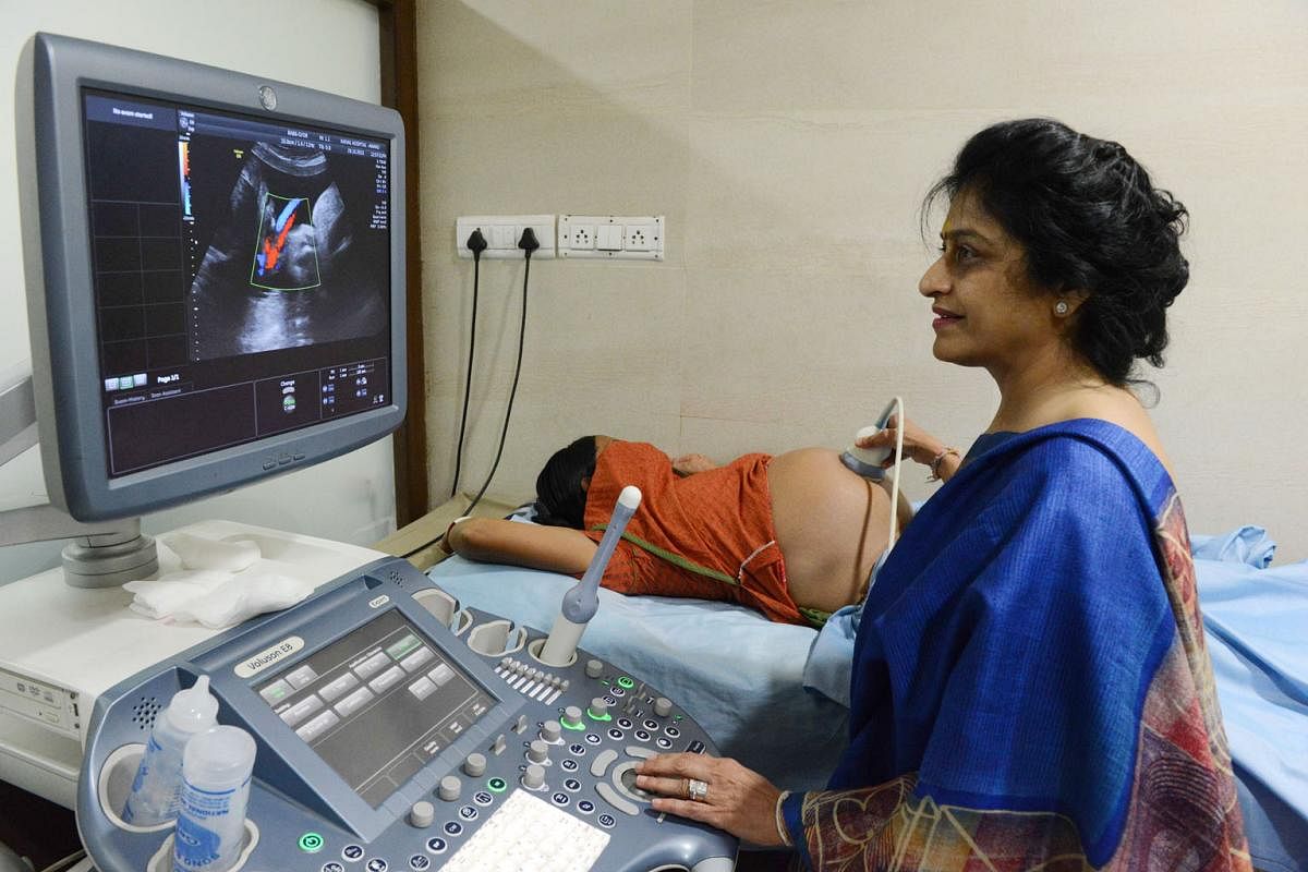 Dr Nayna Patel, a pioneer of reproductive surrogacy in India, conducting an ultrasound on a surrogate mother at Kaival Hospital in Anand, Gujarat state, back in 2015, the same year that India banned commercial surrogacy for foreign nationals in the c