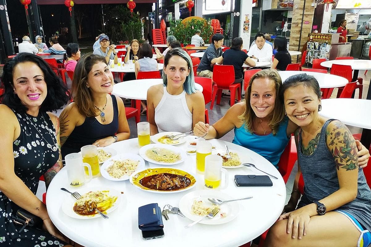 Ms Daniela Tan (left) with guests from Argentina, France and Italy at a coffee shop in Bedok.