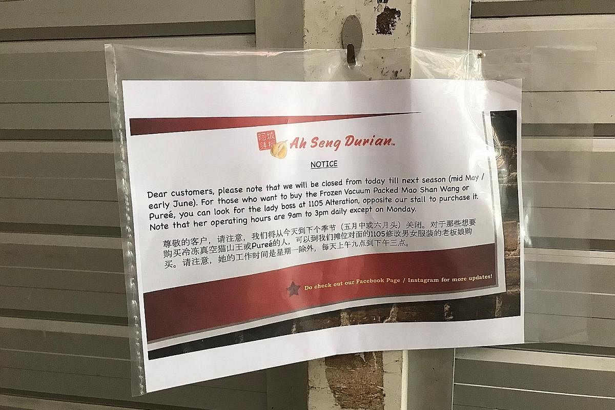 A notice informing customers that Ah Seng Durian, a popular stall at Ghim Moh market, will be closed until mid-May or early June.