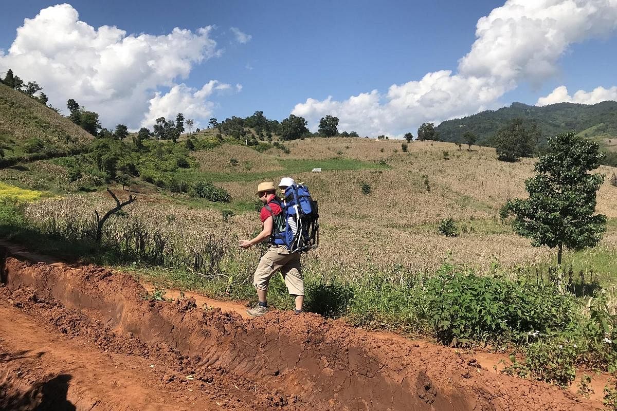 During the two-day trek in northern Shan State, the writer and her husband took turns carrying Elna in a hiking baby carrier.