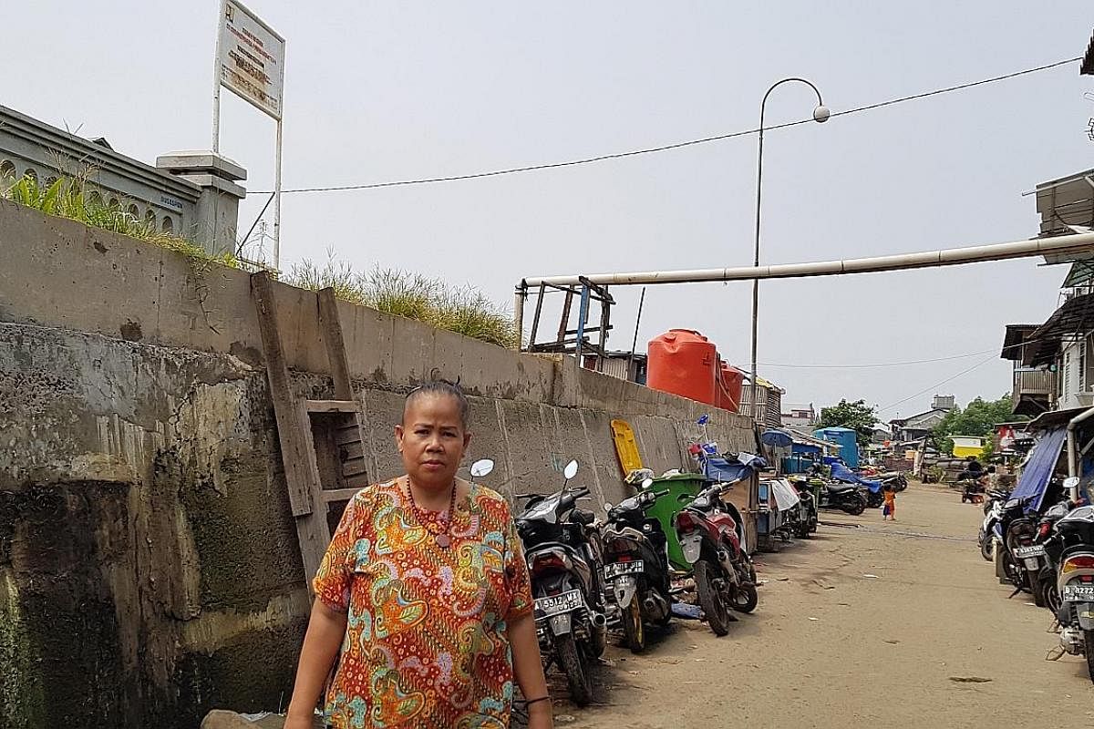 This 2m-high wall helps keep seawater out, but also blocks access to the sea for residents in North Jakarta's Muara Baru neighbourhood. The coastal land is sinking by up to 25cm annually, faster than any other city in the world. As a result, one of A