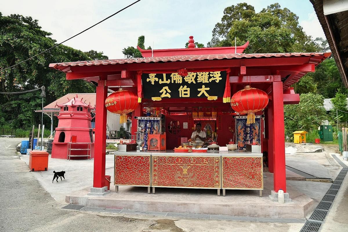 Above: A dragon dance troupe - one of five taking part in the celebrations - arriving at Ubin on May 12. Right: A pagoda-shaped incense furnace was rebuilt based on the original one. The new temple is also identical in design to the one it replaced. 