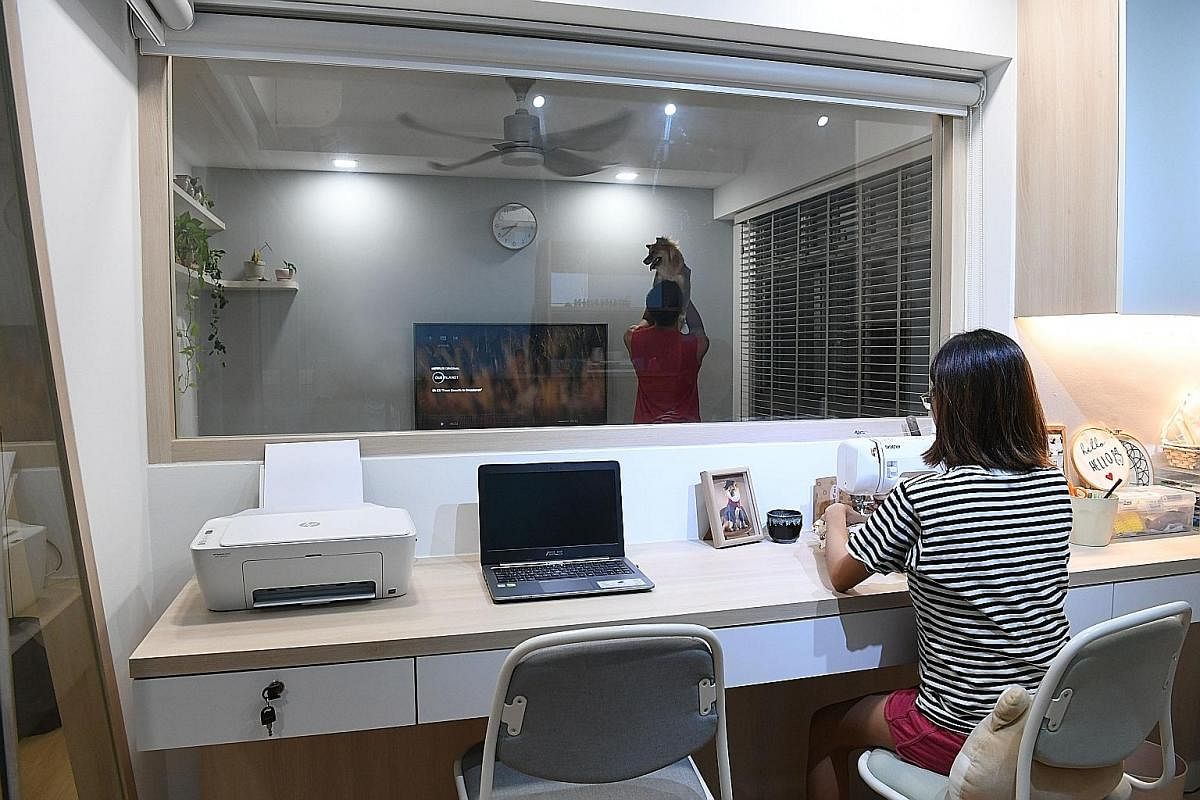 Community organiser Valerie Ong and her husband Samuel Ee turned a bedroom in their four-room flat into an office that doubles as a hobby room and gym.