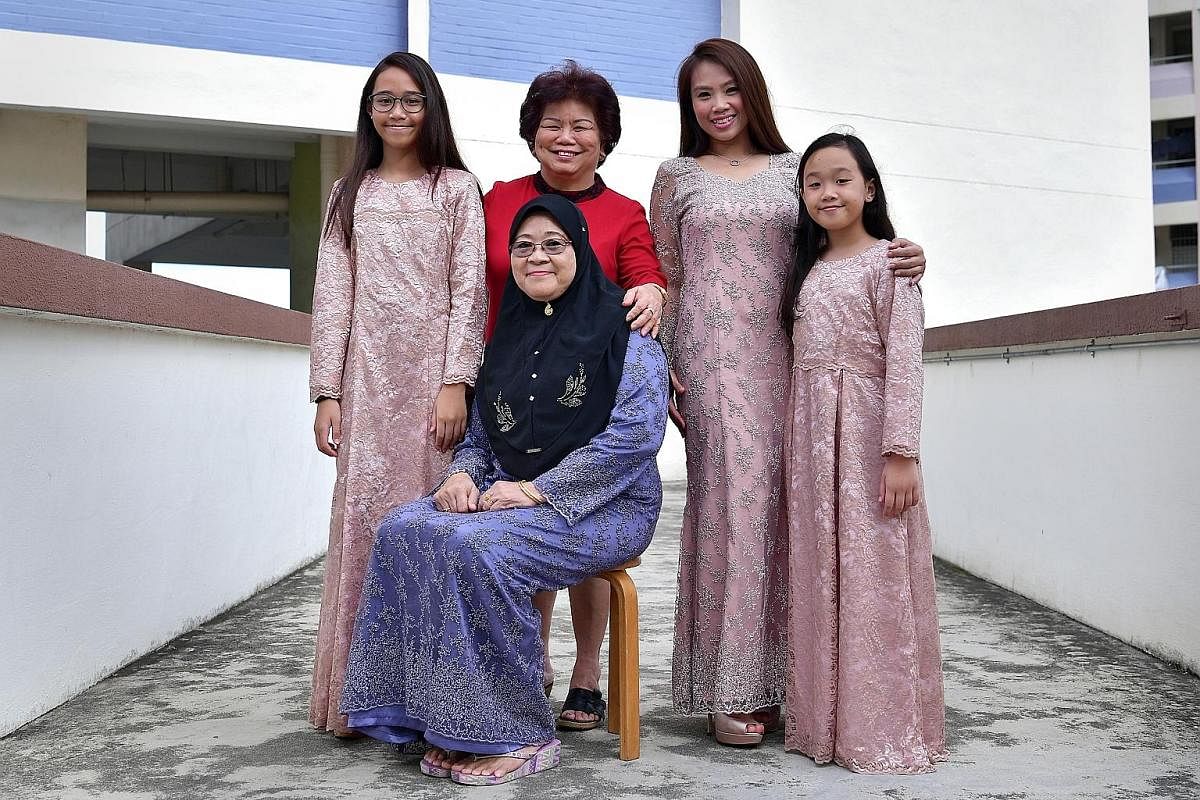 One of Madam Lie’s loyal customers is Madam Zaiton Kuning (seated), 63, whose daughter Siti Norbaya, 43, also frequents the shop with her daughters Nur Syarah Aliah (far left), 13, and Nur Batrisya Qailah, 11. They are wearing this year’s Hari Raya outfit