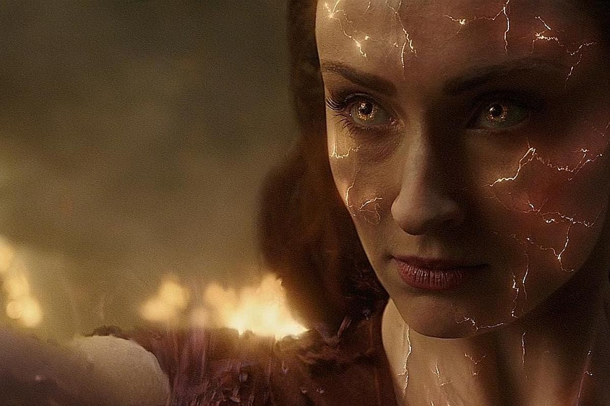 Sophie Turner plays powerful psychic Jean Grey and her alter ego, the titular character, in Dark Phoenix. Dark Phoenix director Simon Kinberg (centre) with stars (from far left) Michael Fassbender, Sophie Turner, Tye Sheridan and Evan Peters at a pre