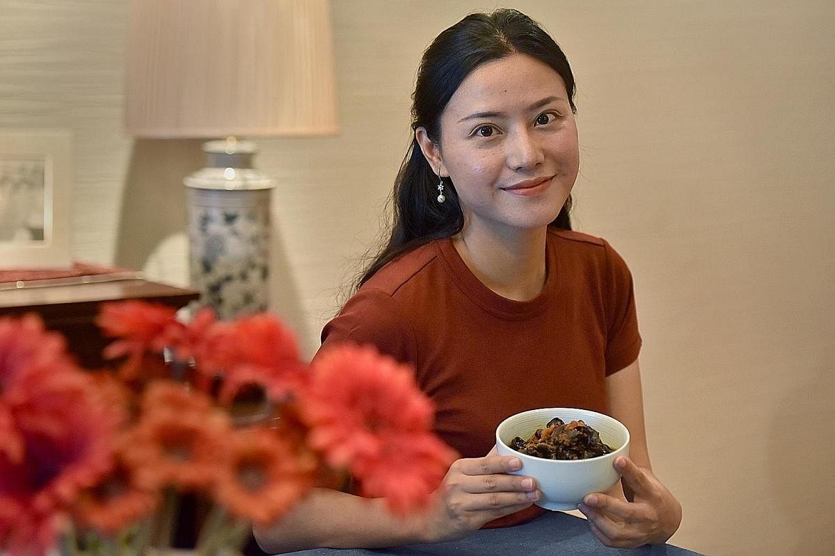 Housewife Liu Yaling with her spicy and sour fungus dish.