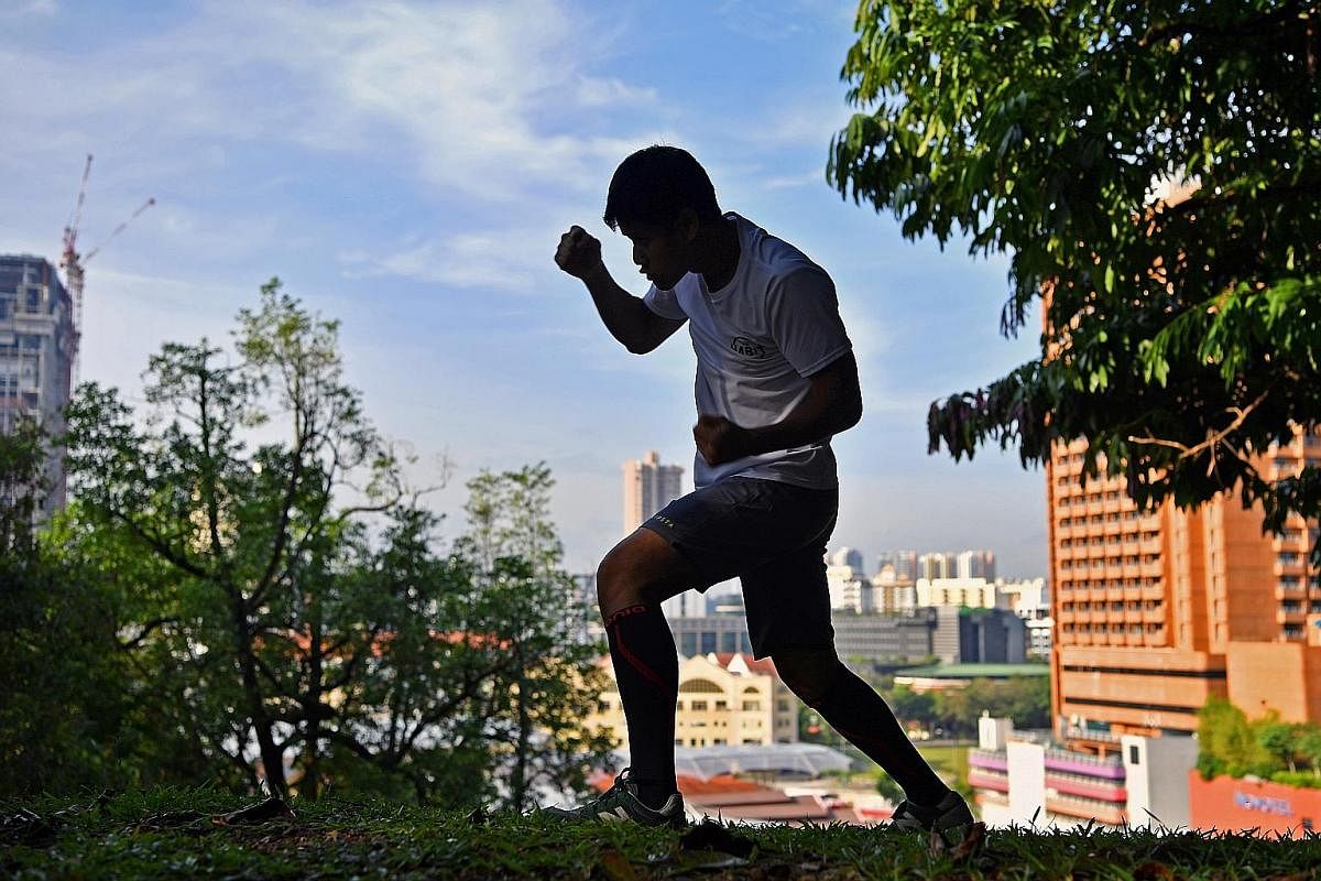 Muhamad Ridhwan shadowboxing after his morning run at Fort Canning Park. The first phase of training before a fight consists of endurance runs, sprints, strength and conditioning exercises, and shadowboxing. The boxer lives by the dictum that one needs to
