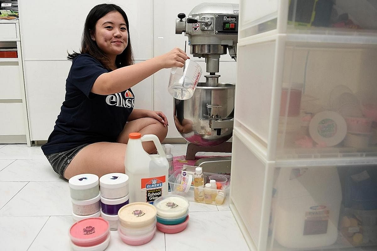 Polytechnic student Adele Lim using a commercial machine to do the slime mixing. She earned a profit of $2,000 last Saturday at a bazaar, selling over 30 types of slime priced at $7.50 a tub.