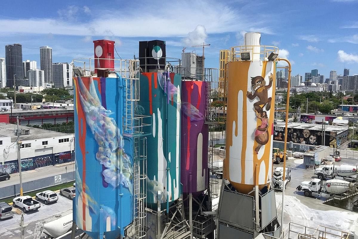 Four old, 23m-high silos have been turned into giant art-covered spray paint cans by local artist Danny "Krave" Fila.