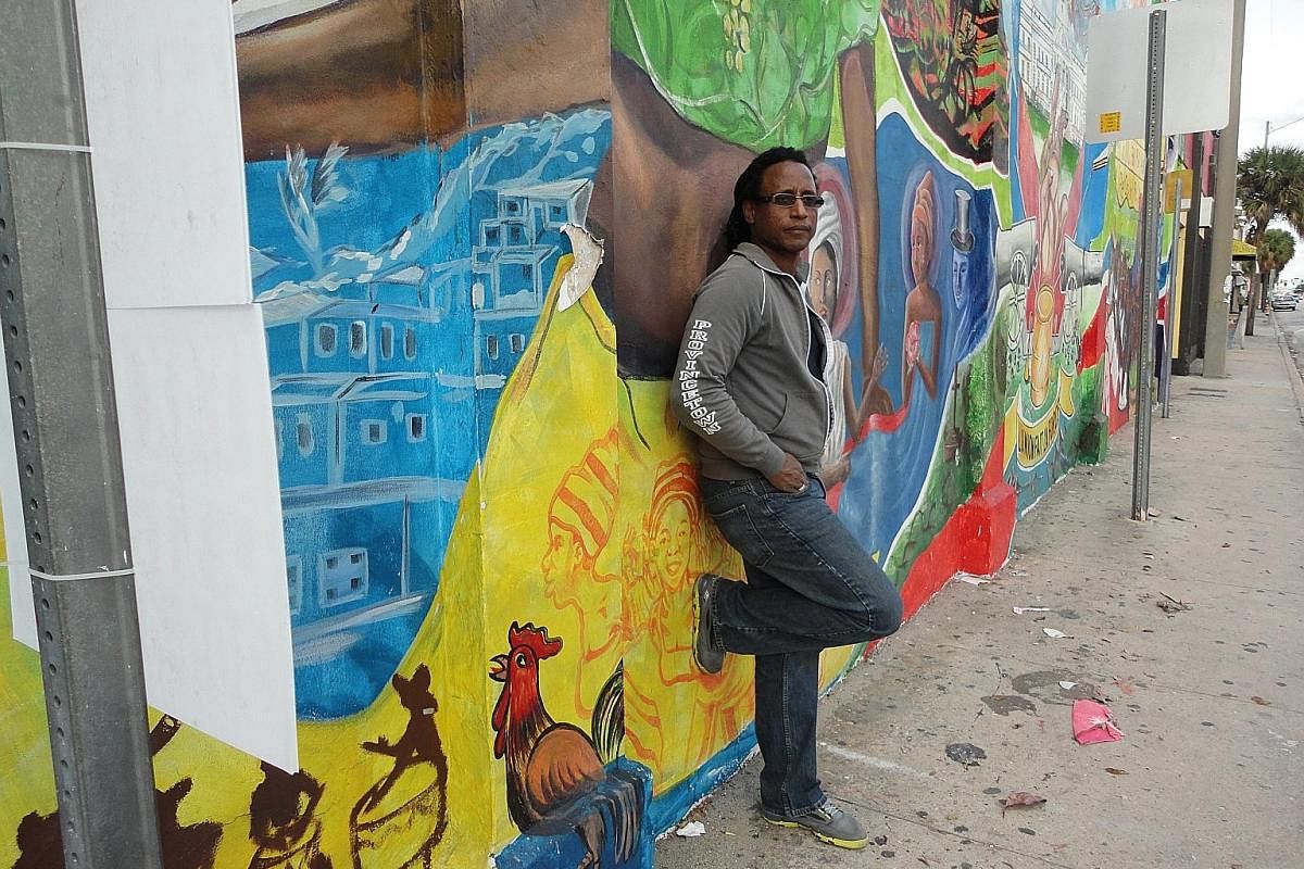 Photographer Carl Juste is a strong champion of the arts in Little Haiti, which has many walls of concrete blocks covered in murals.